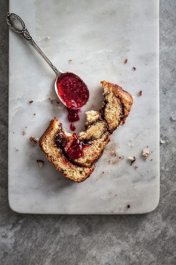 A Piece Of Babka yeast Cake, Central And Eastern Europe With Raspberry Sauce Photograph by The Food Union