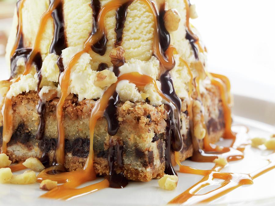 A Piece Of Cake With Ice Cream, Caramel, And Chocolate Sauce Photograph by Jim Scherer