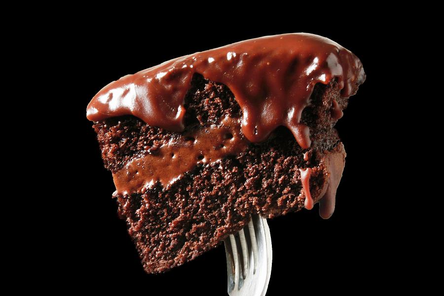 A Piece Of Chocolate Cake On A Fork Photograph by Robert Dodds