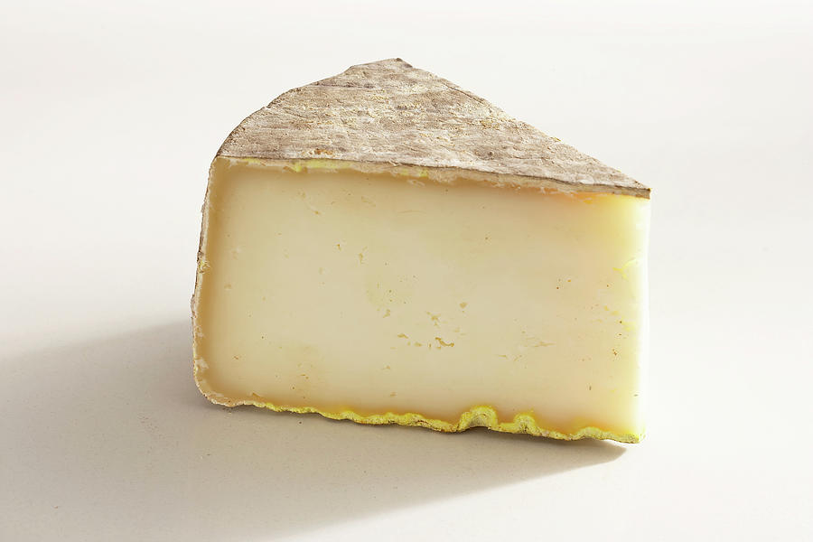A Piece Of French Hard Sheeps Cheese Photograph by Teubner Foodfoto