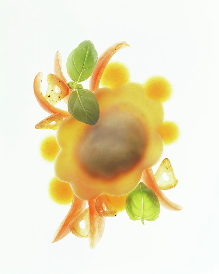 A Piece Of Ravioli With Tomato Filling Photograph by Michael Wissing