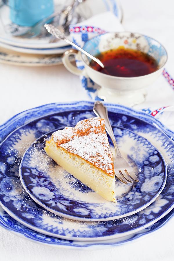 A Piece Of Vanilla Pudding Cake And A Cup Of Tea Photograph by Elisabeth Von Plnitz-eisfeld