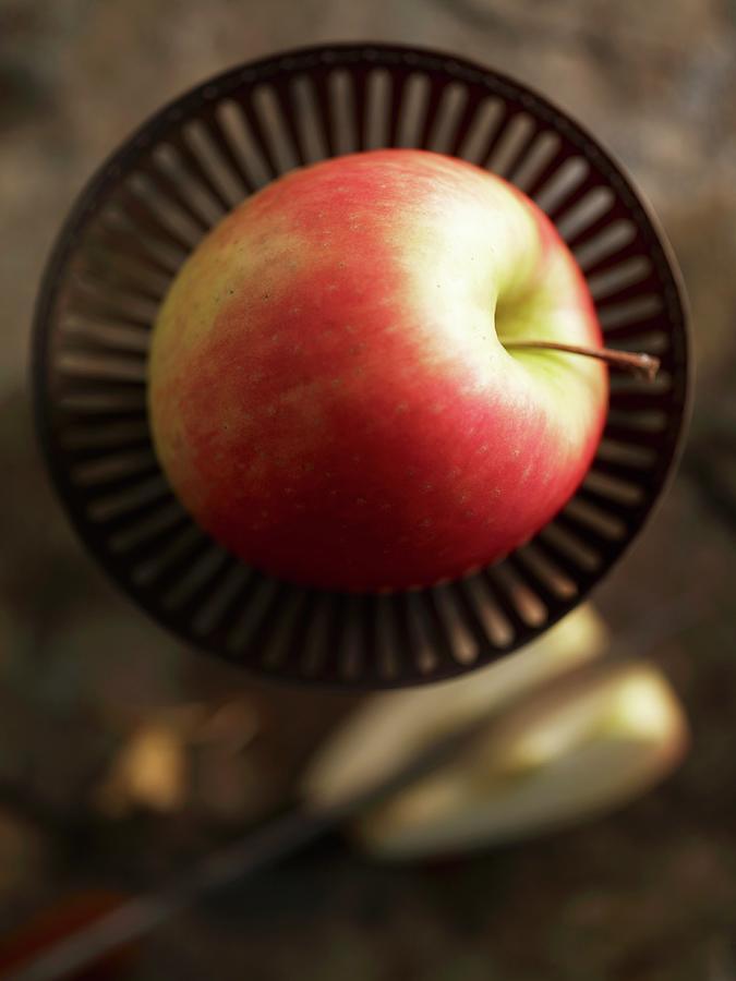 A Pink Lady Apple In A Dish Photograph by Kng, Ruth