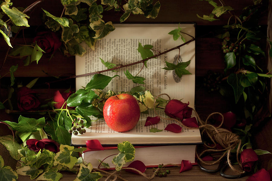 A Pink Lady Apple On Books With Roses And Ivy Photograph by Jane Saunders