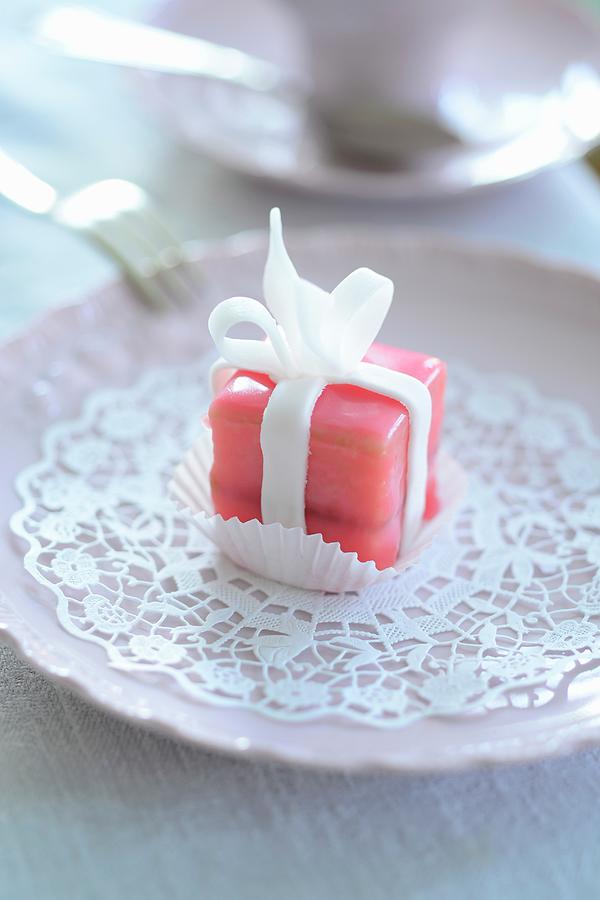 A Pink Petit Four On A Paper Doily Photograph by Tanja Major