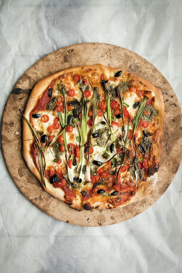 A Pizza On A Baking Stone seen From Above Photograph by Magdalena Hendey