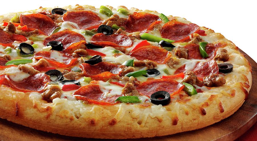 A Pizza Topped With Pepperoni, Pepper, Black Olives And Mozzarella Photograph by Albert P Macdonald