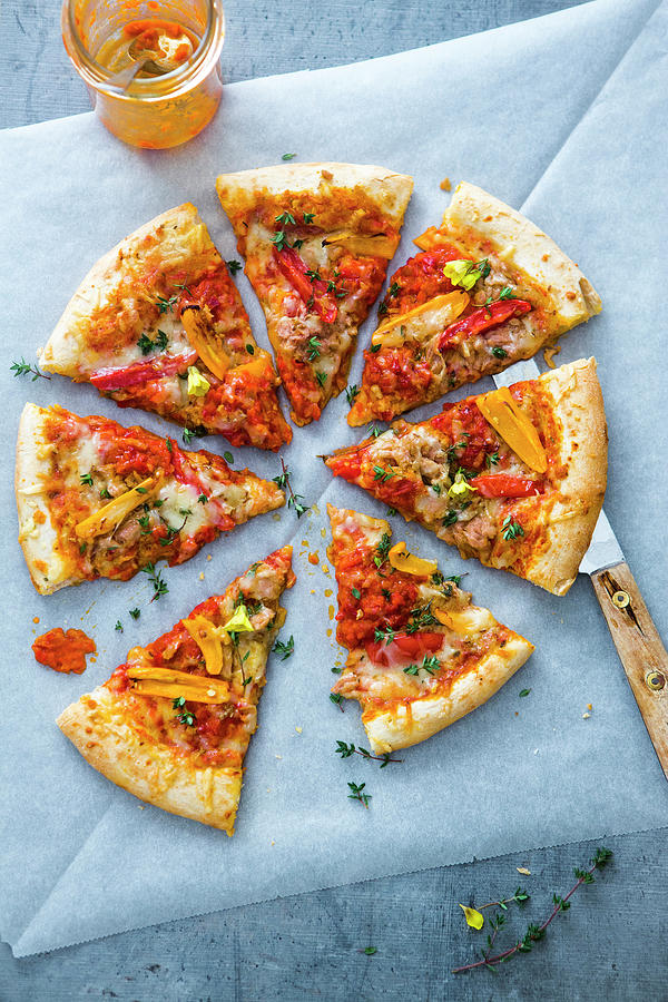 A Pizza With Tuna, Ajvar, Peppers, Tomatoes, Thyme And Alpine Cheese Photograph by Sandra Krimshandl-tauscher