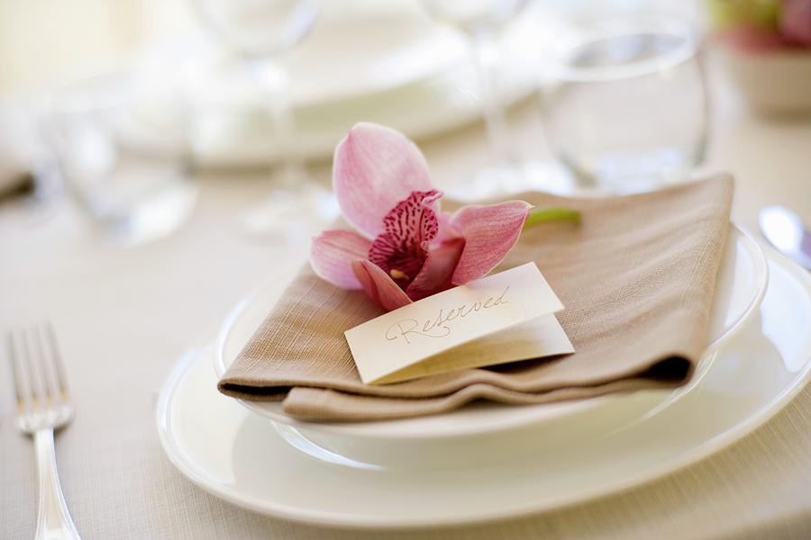 A Place Setting With Place Card And An Orchid Flower Photograph by Imagerie