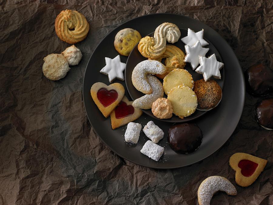 A Plate Of Assorted Christmas Biscuits Photograph by Nikolai Buroh