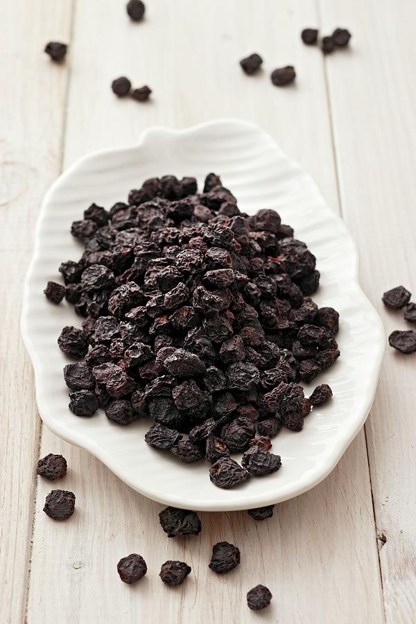 A Plate Of Dried Aronia Photograph by Petr Gross