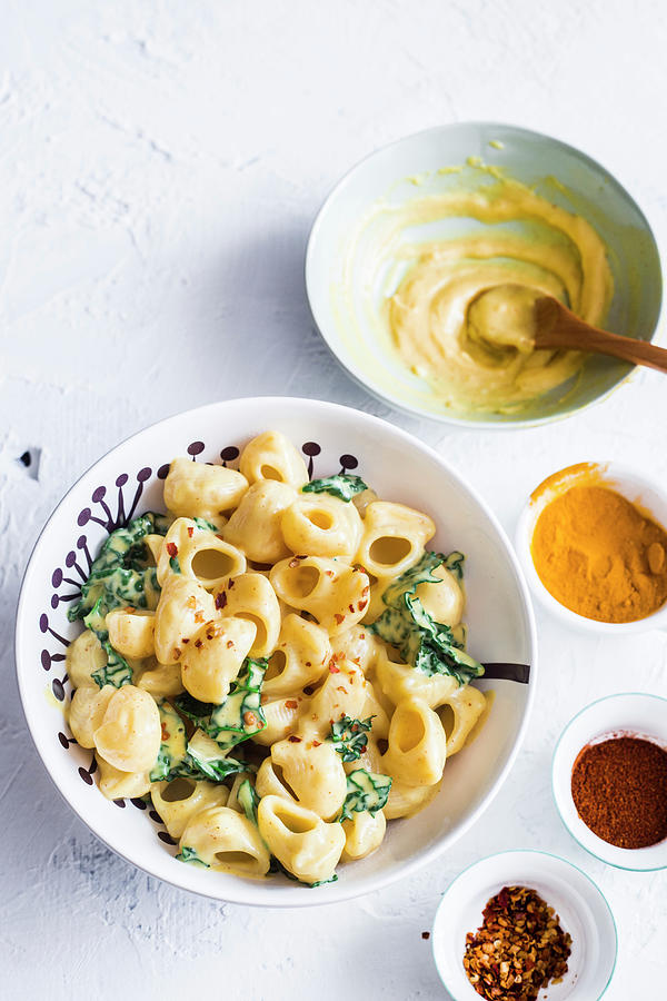A Plate Of Vegan Mac And Cheese With Kale Made With Vegan Bechamel soy Milk And Olive Oil, Turmeric And Paprika Powder Photograph by Maricruz Avalos Flores