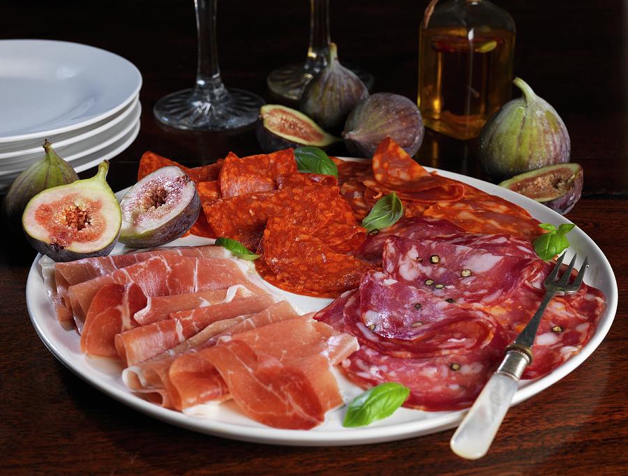 A Platter Of Cold Cuts With Figs And Basil Photograph by Robert Morris