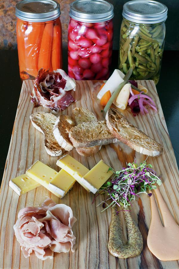 A Platter Of Ham With Pickles, Crostini, Mustard And Manchego Cheese Photograph by Amy Kalyn Sims