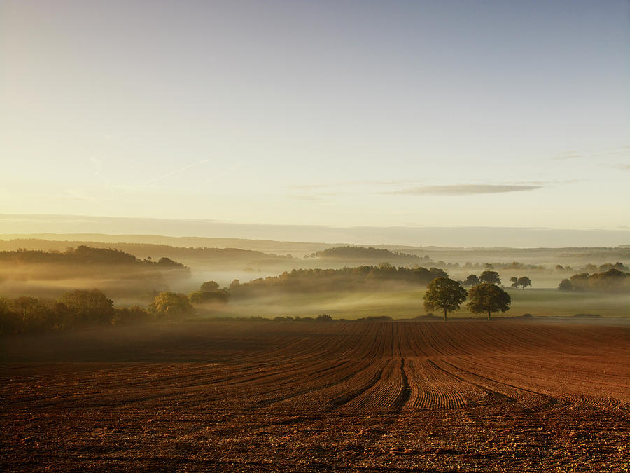A Ploughed Field And View Over Photograph by Mint Images