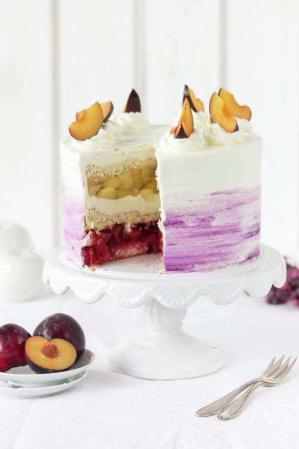 A Plum, Apple, And Poppy Cake With Whipped Cream Photograph by Emma Friedrichs