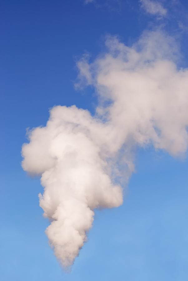 A Plume Of Smoke In The Blue Sky Photograph by Gmnicholas