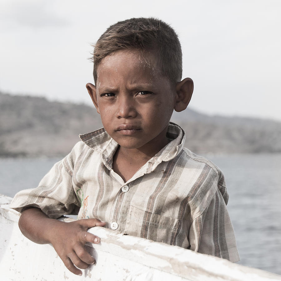 A Poignant Image Of A Boy And His Boat Photograph by Vladimir Pauco