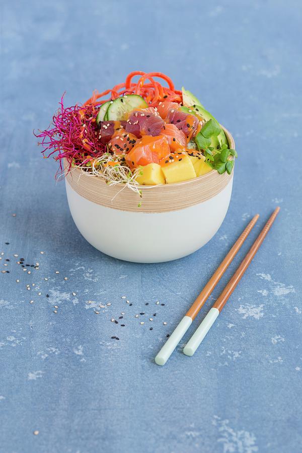 A Poke Bowl With Tuna, Salmon, Sushi Rice, Tobiko, Avocado, Carrots, Mango, And Sprouts Photograph by Tina Engel