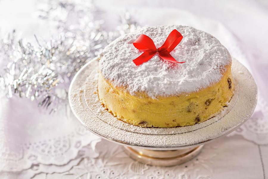 A Polish Christmas Cheesecake Decorated With A Red Bow On A Silver Cake Stand Photograph by Lukasz Zandecki