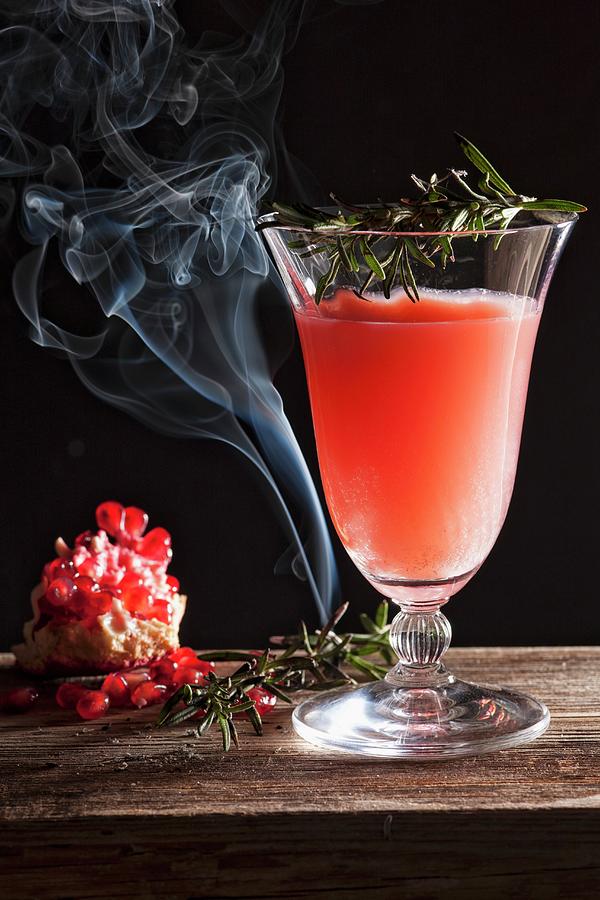 A Pomegranate Cocktail With Rosemary Photograph by Danny Lerner