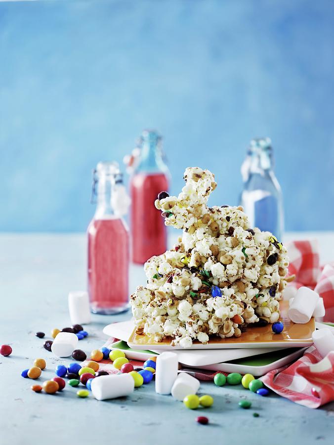 A Popcorn Figure On Caramel Sauce For A Childs Birthday Party Photograph by Mikkel Adsbl