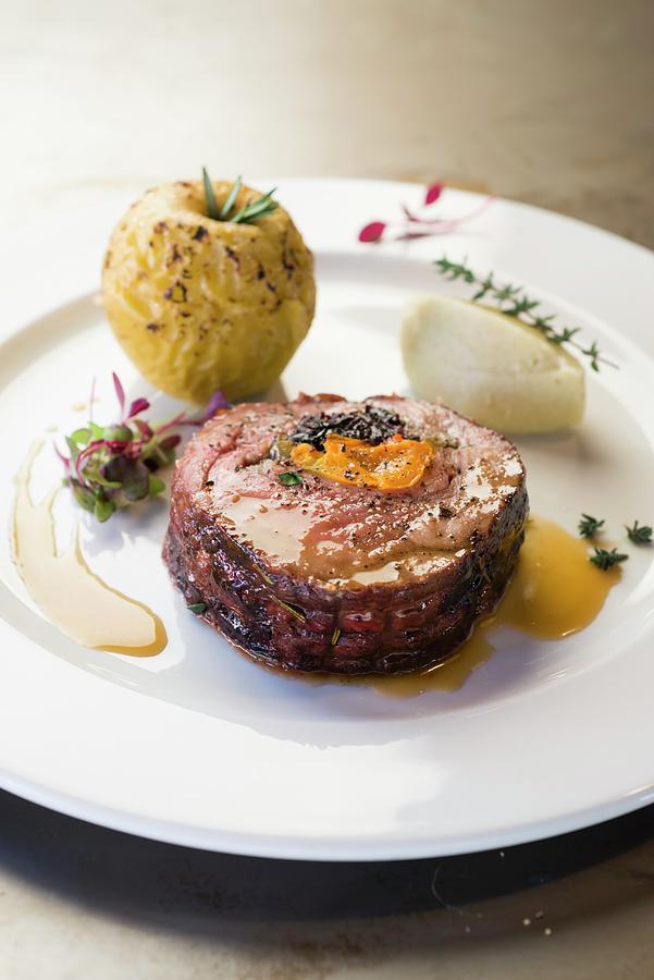 A Pork Collar Steak Filled With Dried Plums And Blue Cheese And Served With A Baked Apple Photograph by Great Stock!