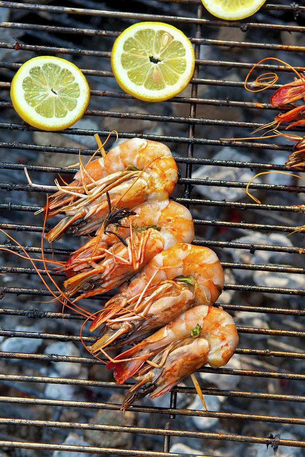 A Prawn Skewer On A Charcoal Grill Photograph by Studio Lipov