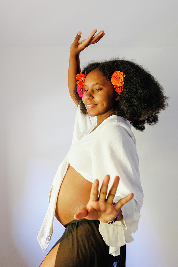 Flower Photograph - A Pregnant Woman Dances With Flowers In Her Hair by Cavan Images / Rebecca Tien