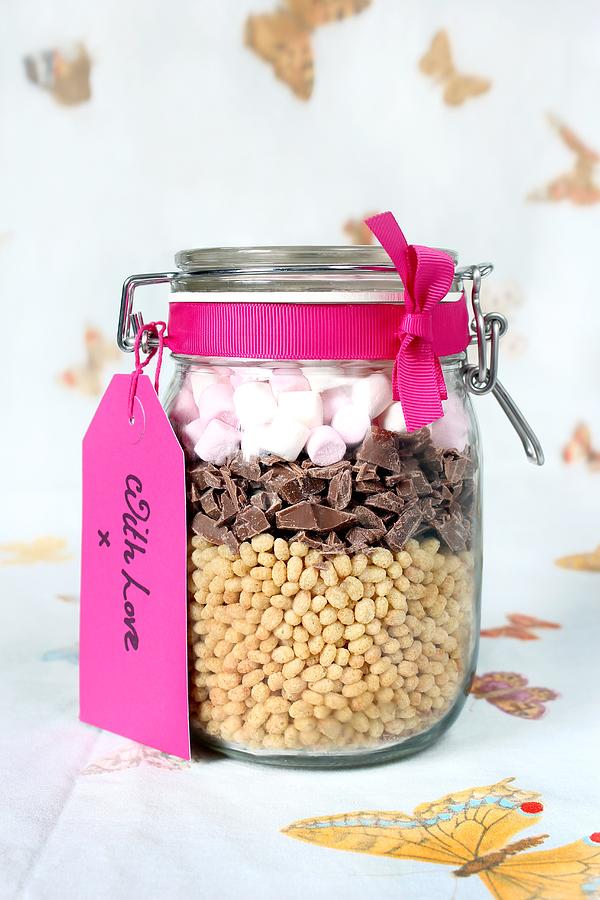 A Preserving Jar Containing Dry Ingredients For Making Puffed Rice And Chocolate Bars With Marshmallows Photograph by Mowbray, Philip