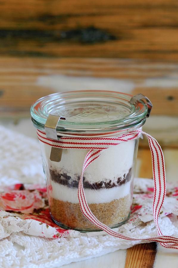 A Preserving Jar Containing The Dry Ingredients For Chocolate Biscuits Photograph by Patrikiou, Elissavet