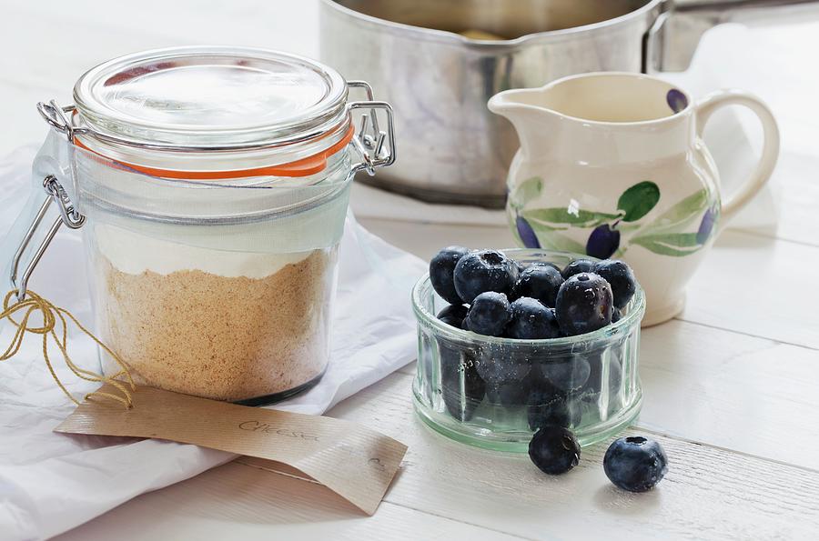 A Preserving Jar With Dry Ingredients For Making Cheesecake, Blueberries To One Side Photograph by Lowe, Cath