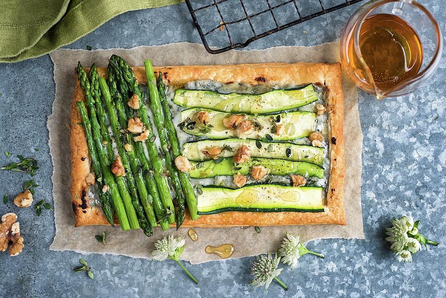 A Puff Pastry Tart With Courgettes, Asparagus And Blue Cheese Photograph by Lucy Parissi
