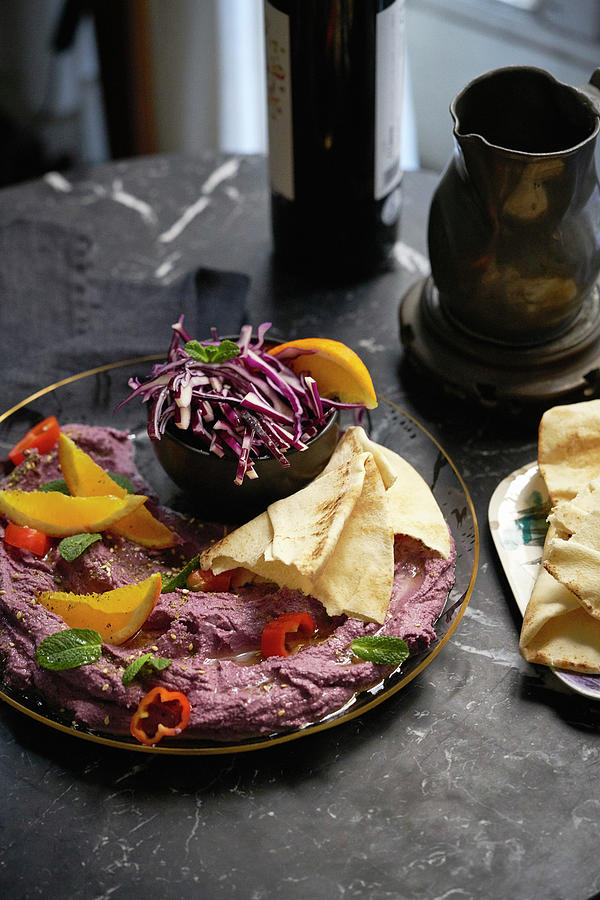 A Purple Dip With Flatbread, Oranges And Vegetables Photograph by Malgorzata Stepien