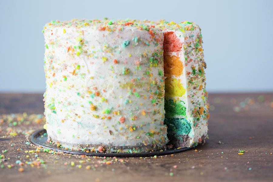 A Rainbow Layer Cake With White Frosting Photograph by Malgorzata Laniak