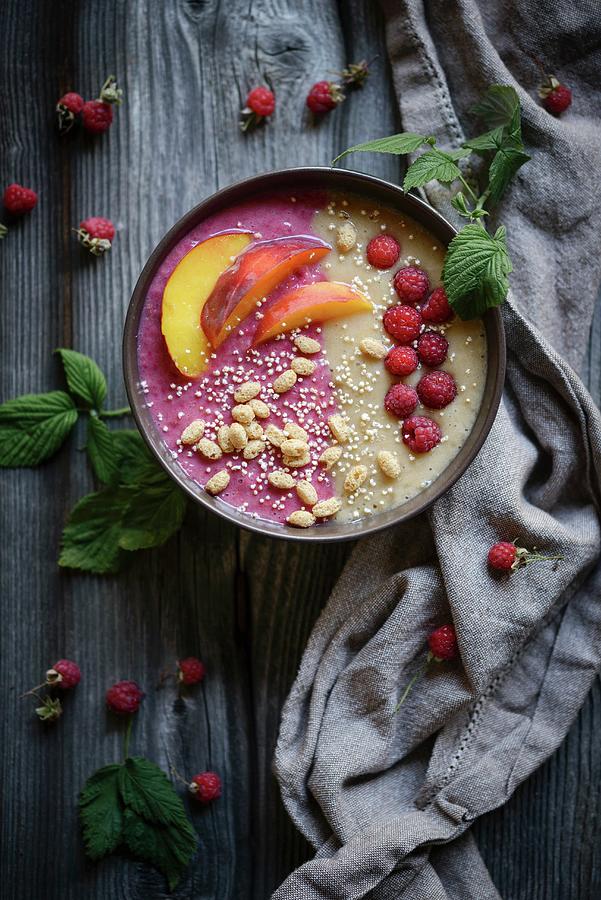 A Raspberry And Peach Smoothie Bowl With Oat And Amaranth Pops vegan Photograph by Kati Neudert
