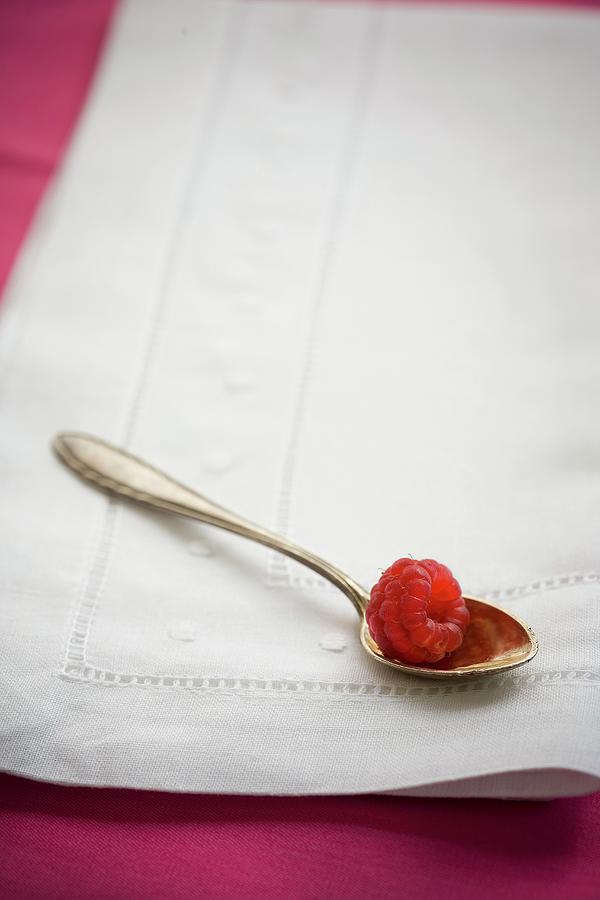 A Raspberry On A Silver Spoon Photograph by Rose Hodges