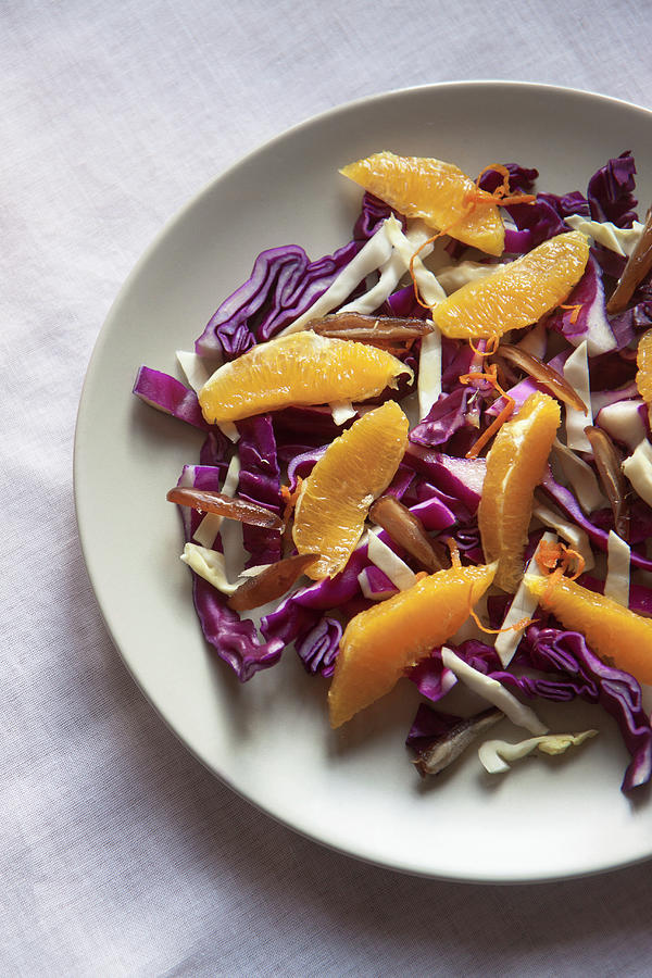 A Raw And Healthy Winter Salad Ith Red Cabbage, White Cabbage, Dates, Orange, Zest Of Orange Photograph by Lee Parish
