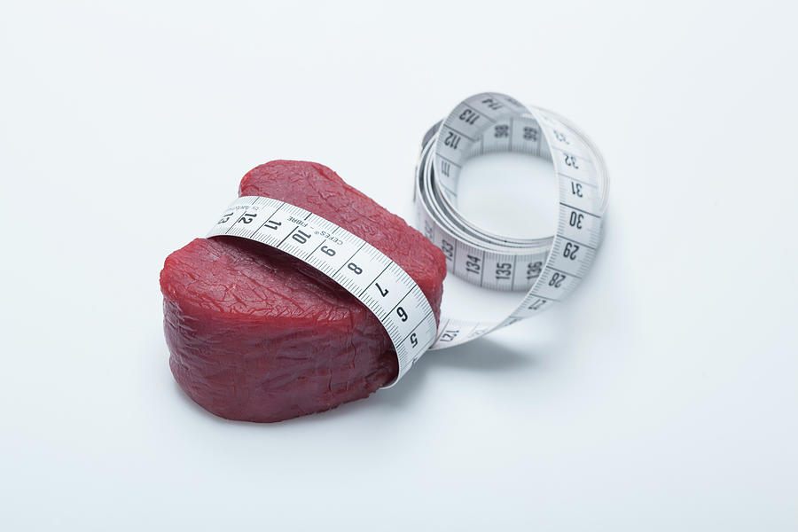 A Raw Fillet Of Beef With A Tape Measure Photograph by Eising Studio