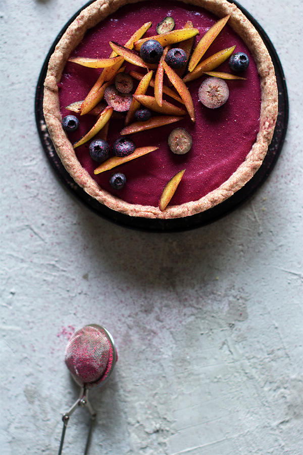 A Raw Plum And Vanilla Tart With Blueberries Photograph by Pilar Felix