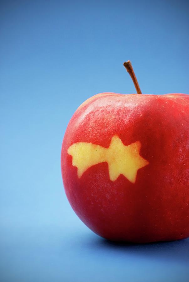 A Red Apple With A Shooting Star Photograph by Petr Gross