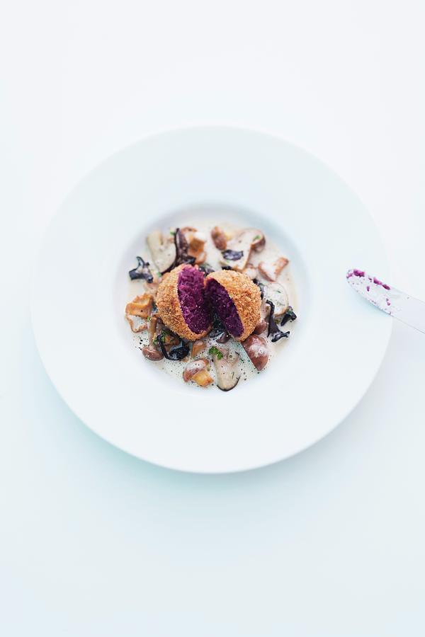 A Red Cabbage Dumpling On A Mushroom Ragout Photograph by Michael Wissing