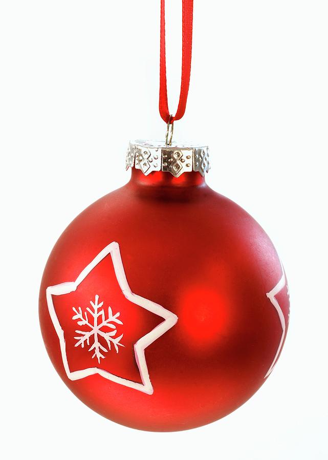 A Red Christmas Bauble With A White Star Photograph by Friedrich Strauss