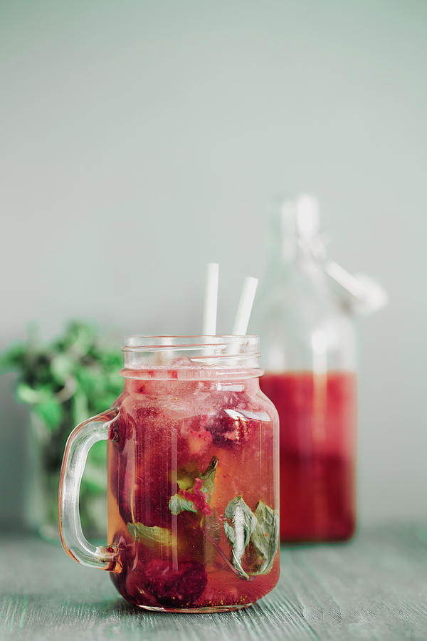 A Refreshing Drink With Wild Berries And Mint Photograph by Valeria Aksakova
