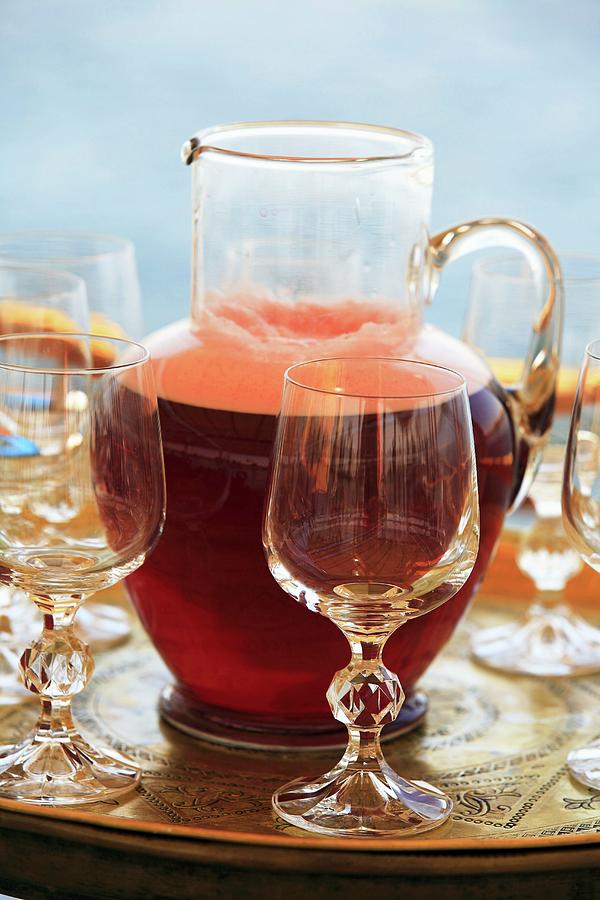 A Refreshing Red Drink In A Carafe With Glass Stemware On A Tray, Egypt Photograph by Guy Bouchet
