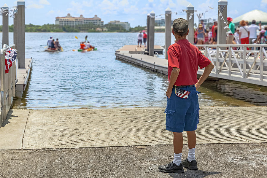 A retired veteran looks down a boat launching slip as the small by Manny DaCunha A retired veteran looks down a boat launching slip as the small by Manny DaCunha