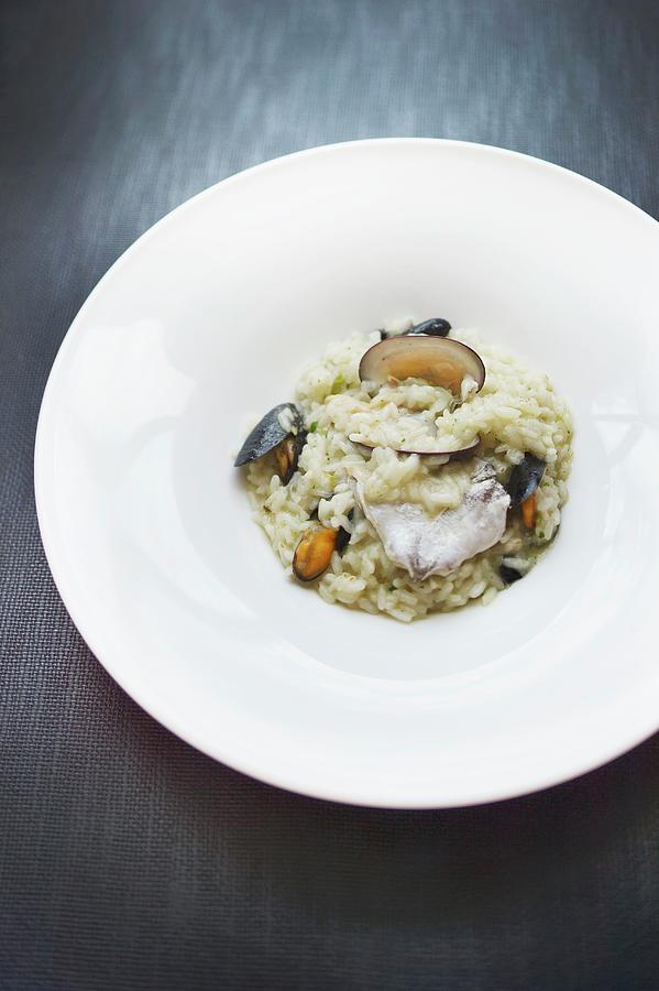 A Rice Dish With Mussels And Hake From The Restaurant Narru In San Sebastin Photograph by Jalag / Maria Schiffer