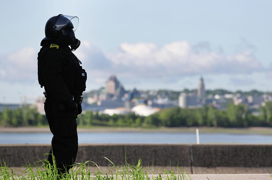 A Riot Police Officer Stands Guard Photograph by Jonathan Ernst - Fine ...