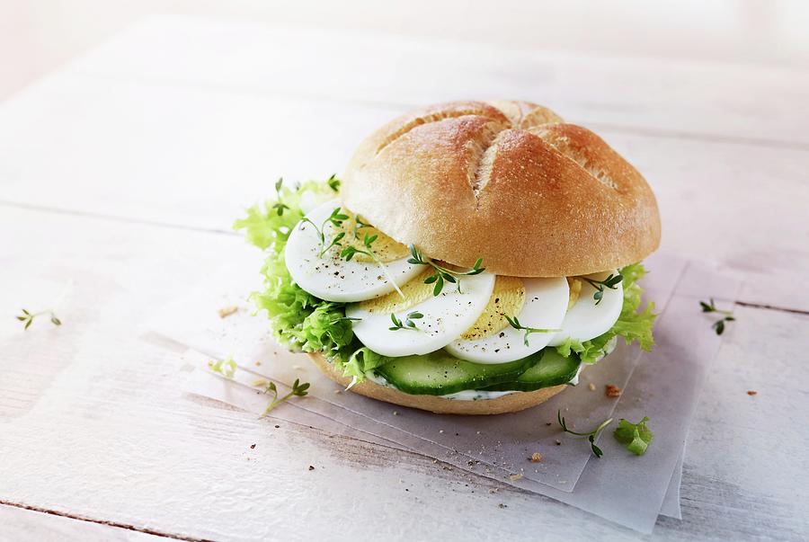 A Roll With Egg, Cucumber, Lettuce And Cress Photograph by Thorsten Kleine Holthaus