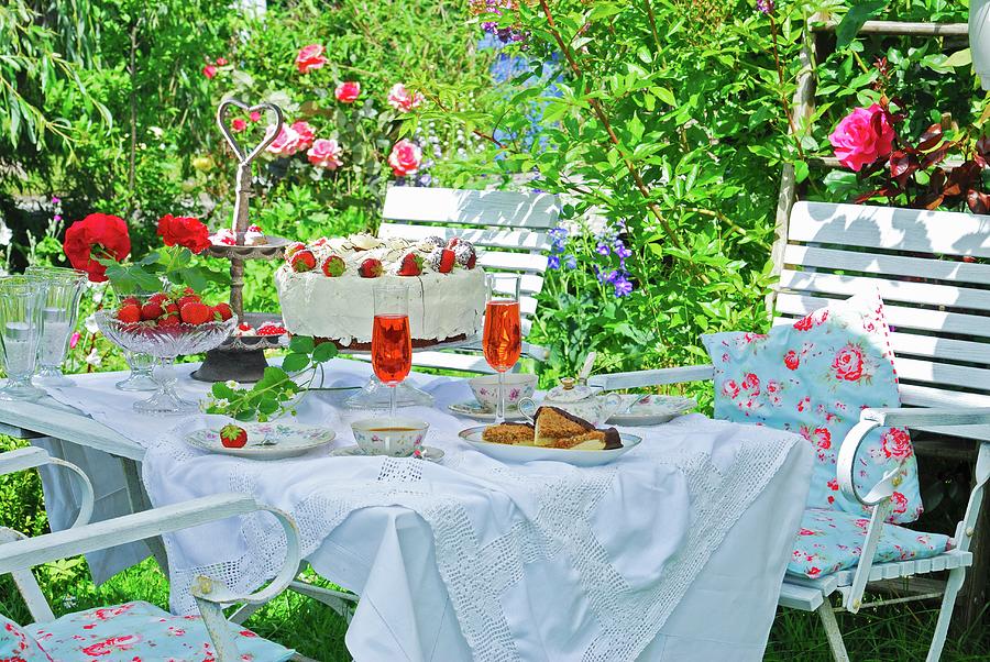 A Romantic Coffee Table With A Strawberry Cake In A Summer Garden Photograph by Ursula Sonnenberg